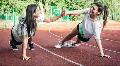 young-women-doing-stretching-exercises-stadium 1